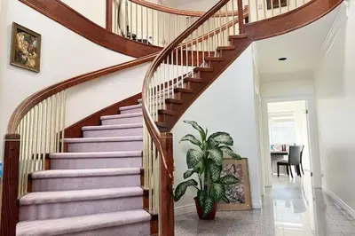 a spiral staircase in a home with a plant at Two Bedrooms One King Bed and One Double Bed in Richmond
