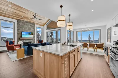 a kitchen and living room with views of a living room at Western Star Chalet Ski in out and Amazing Mtn View in Big White