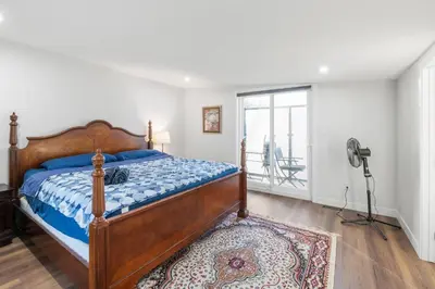 a bedroom with a bed and a camera on a tripod at Spacious Home • 3BR • Close to Whyte and Downtown in Edmonton