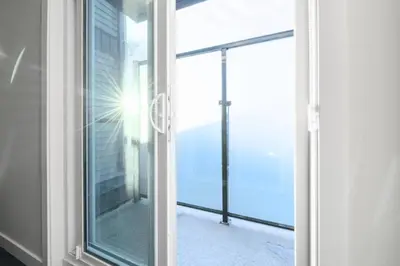 a sliding glass door with a view of a balcony at Spacious Home • 3BR • Close to Whyte and Downtown in Edmonton