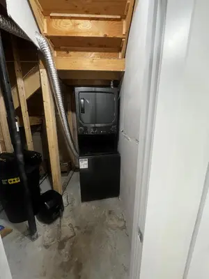 a small room with a tv in a basement at Private room in Basement suite in Edmonton