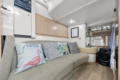 a living room with a couch in a caravan at COSY FLOATING HOME IN Vancouver downtown in Vancouver