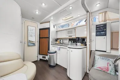 an interior view of a kitchen in an rv at COSY FLOATING HOME IN Vancouver downtown in Vancouver