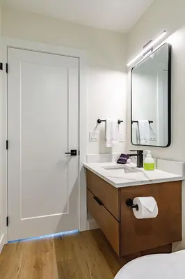 a bathroom with a sink and a mirror at Ravens Peak - Private Hot Tub in Canmore