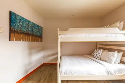 a bedroom with bunk beds in a dorm room at Alpen Glow at Canmore Crossing in Canmore