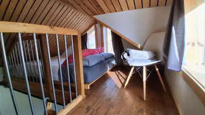 a room with a bunk bed and a crib at Yukon Sweet Spot Bed and Bakery in Whitehorse