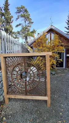 a wooden gate with a fence in front of a house at Yukon Sweet Spot Bed and Bakery in Whitehorse