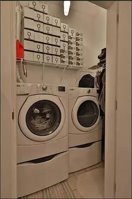 a laundry room with a washer and dryer at Ice District 2 Kings Private Parking Patio in Edmonton