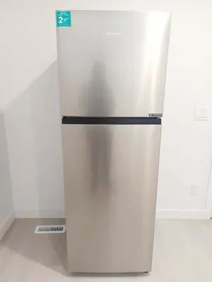 a white refrigerator sitting in a kitchen at 43 Erin Woods Drive SE Calgary in Calgary