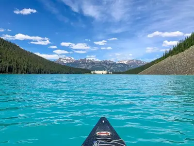 a kayak on a lake with mountains in the background at Golden Moments in Golden