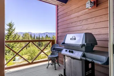 a grill on a screened in porch with a view at Whispering Pines 3BR Townhouse Views and private Hot Tub in Golden