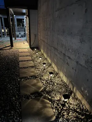 a row of wine glasses on the ground next to a wall at Lovely 2 bedroom suite in Langford in Metchosin