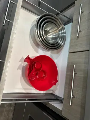a red item on a shelf in a kitchen at Family friendly home at Chappelle garden in Edmonton