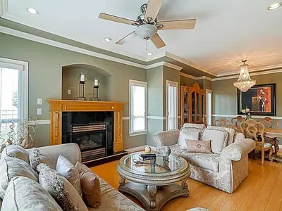 a living room with a couch and a fireplace at 5 Minutes away from Edmonds Station! Ideal location for all events & attractions in New Westminster