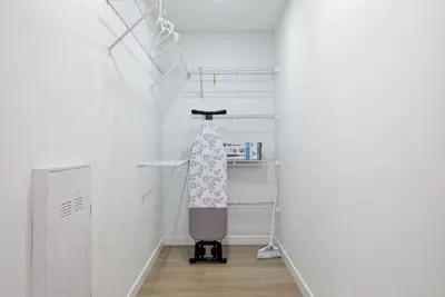 a walk in closet with a pink vacuum in a room at Luxury 1Beds and 2Beds in Downtown Edmonton close to Rogers in Edmonton
