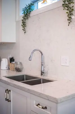 a kitchen counter with a sink and a window at New Quiet Charming 1BR Suite near UBC & PW Park in Vancouver