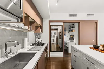 a kitchen with a sink and a counter at Modern Chic Apartment with Balcony & Workspace in Vancouver