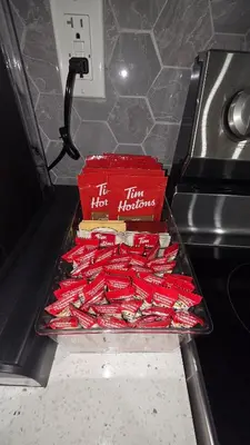 two boxes of hot dogs on a tray on a stove at Home Away From Home With Free Netflix, Prime and Paramount in Calgary