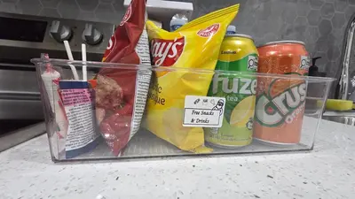 a plastic container filled with food and drinks on a counter at Home Away From Home With Free Netflix, Prime and Paramount in Calgary