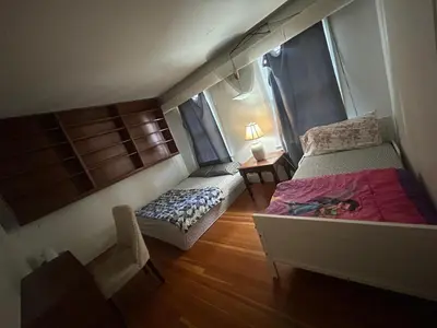 a small bedroom with a bed and a window at Vancouver Home - Airport 10 Min, Downtown 15 Min - Free Parking & Fast Wi-Fi in Vancouver