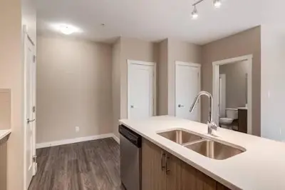 a kitchen with a sink and a counter top at Mdx in Edmonton