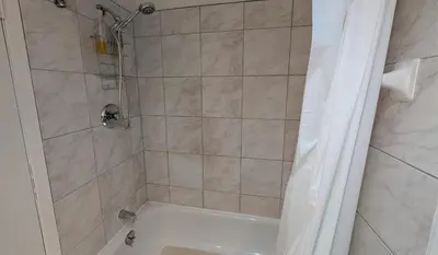 a bathroom with a shower with a sink and a toilet at Unit 33 - 4 bedrooms - Sleeps 10 in Bélanger