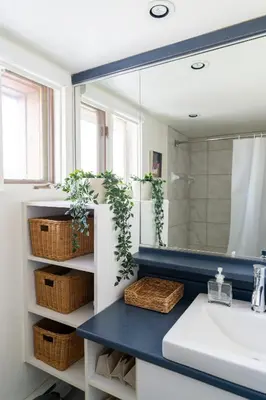 a bathroom with a sink and a mirror at Unit 33 - 4 bedrooms - Sleeps 10 in Bélanger