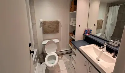 a bathroom with a toilet and a sink at Unit 33 - 4 bedrooms - Sleeps 10 in Bélanger