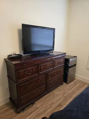 a television on top of a dresser in a room at Bright Private Room in Echo Valley Home in Victoria