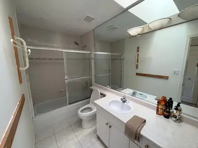 a bathroom with a toilet and a sink and a shower at Vancouver Guest House - Airport & Downtown 15 Min - Free Parking & Fast Wi-Fi in Vancouver