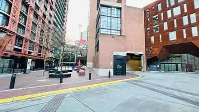 an empty street in a city with tall buildings at Ocean and Mountain View Home - Downtown Vancouver in Vancouver