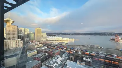 a view of a city with a river and buildings at Ocean and Mountain View Home - Downtown Vancouver in Vancouver