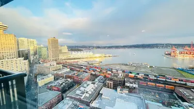 a view of a city with a river and buildings at Ocean and Mountain View Home - Downtown Vancouver in Vancouver