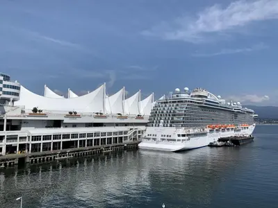 two cruise ships are docked next to a dock at Central Lonsdale Gem in North Vancouver