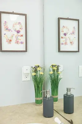 three vases with flowers in them on a table at Rocky Mountain Retreat-Mountain View! in Canmore