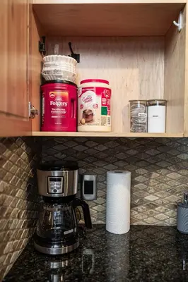 a coffeemaker sitting on a counter in a kitchen at Rocky Mountain Retreat-Mountain View! in Canmore