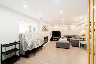 a living room with a table and a couch at Modern Private 2 BR with 1 bath, 3 beds, West Van in West Vancouver