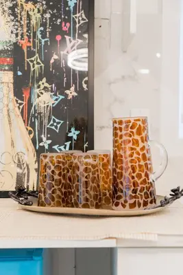 two coffee mugs on a plate on a table at Modern Private 2 BR with 1 bath, 3 beds, West Van in West Vancouver