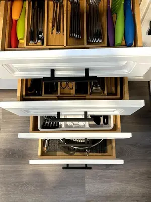a kitchen with wooden cabinets with utensils at 2BD cozy guest suite in West Vancouver! in West Vancouver