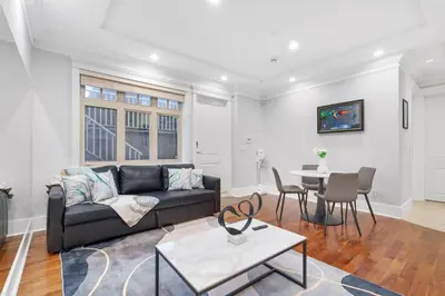 a living room with a couch and a table at NEW Private 1BR Near Kerrisdale and UBC w Laundry in Vancouver