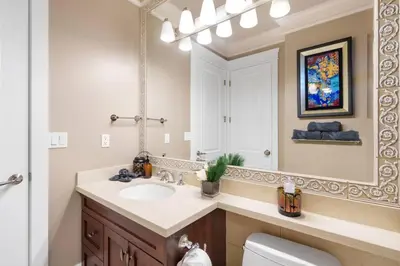a bathroom with a sink and a mirror at NEW Private 1BR Near Kerrisdale and UBC w Laundry in Vancouver