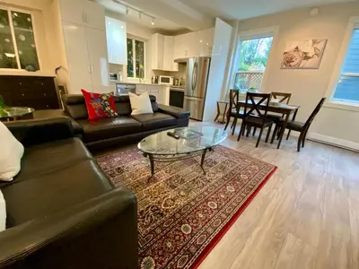 a living room with a couch and a glass table at Ridge Pointe Retreat Your Victoria Hideaway in Colwood
