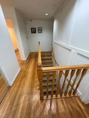 a staircase in a house with wooden floors at Vancouver Budget Stay- Free Parking, Fast WiFi, Near Airport & Downtown 15 Min in Vancouver
