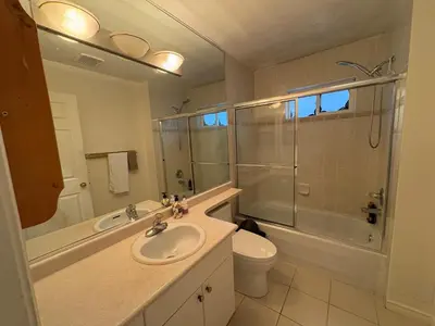 a bathroom with a sink and a shower and a toilet at Vancouver Budget Stay- Free Parking, Fast WiFi, Near Airport & Downtown 15 Min in Vancouver