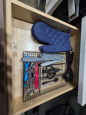 a cage in a rv with a chair in it at YYC Cozy Suites in Calgary