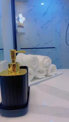 a bathroom with a sink and a towel at Brand New cozy apartment bright, modern private 2 bedroom basement! in Calgary
