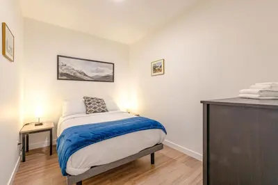 a small bedroom with a bed and a dresser at Modern 2BR in Golden w/ Stunning MTN Views! in Golden