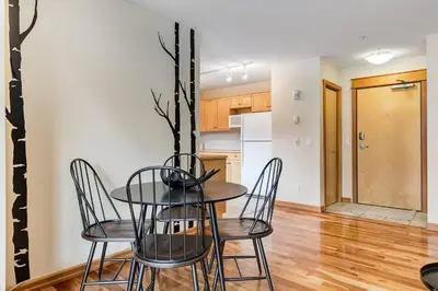 a dining room with a table and chairs at Cozy 2 BR Condo plus Gym with Stunning Mountain View in Canmore