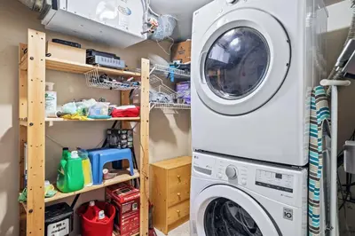 a laundry room with a washer and dryer at Peaceful 2BR Retreat with MTN Views Close to Banff in Canmore