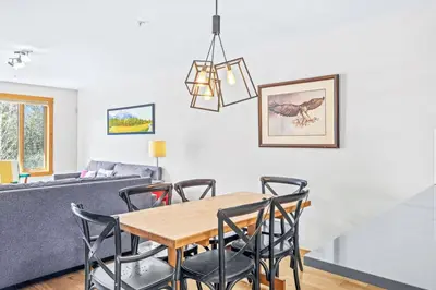 a dining room with a table and chairs at Peaceful 2BR Retreat with MTN Views Close to Banff in Canmore